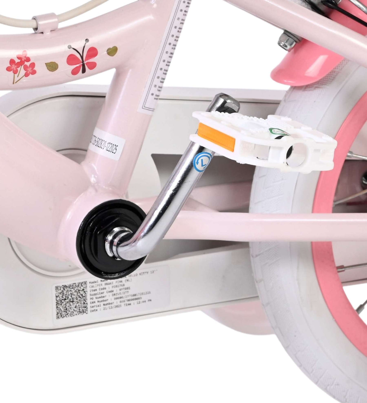 Rosa Kinderfahrrad mit Pedal und Blumenmuster am Rahmen