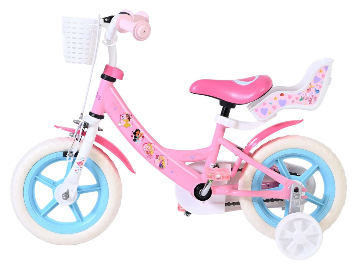 Rosa Kinderfahrrad mit weißen Reifen und Korb vorne