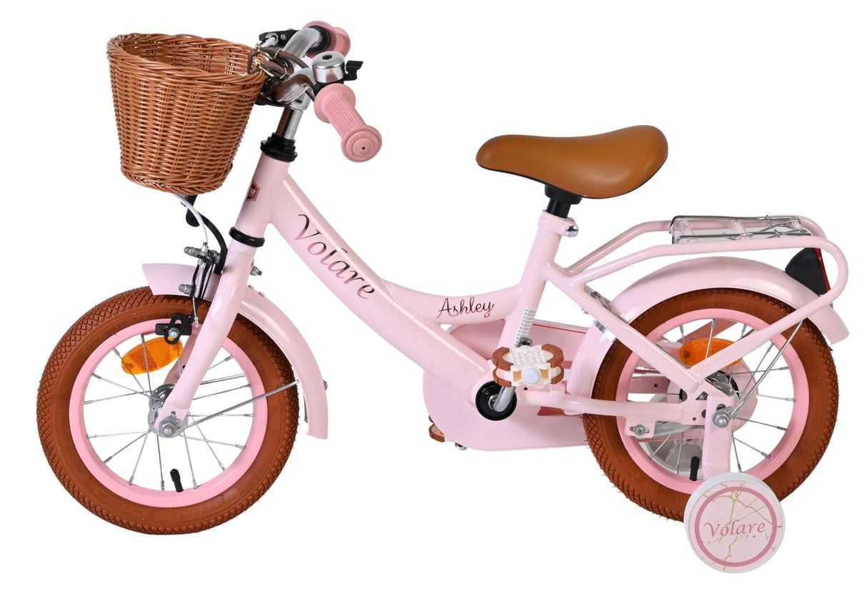 Rosa Kinderfahrrad mit Korb, braunem Sattel und stabilen Reifen