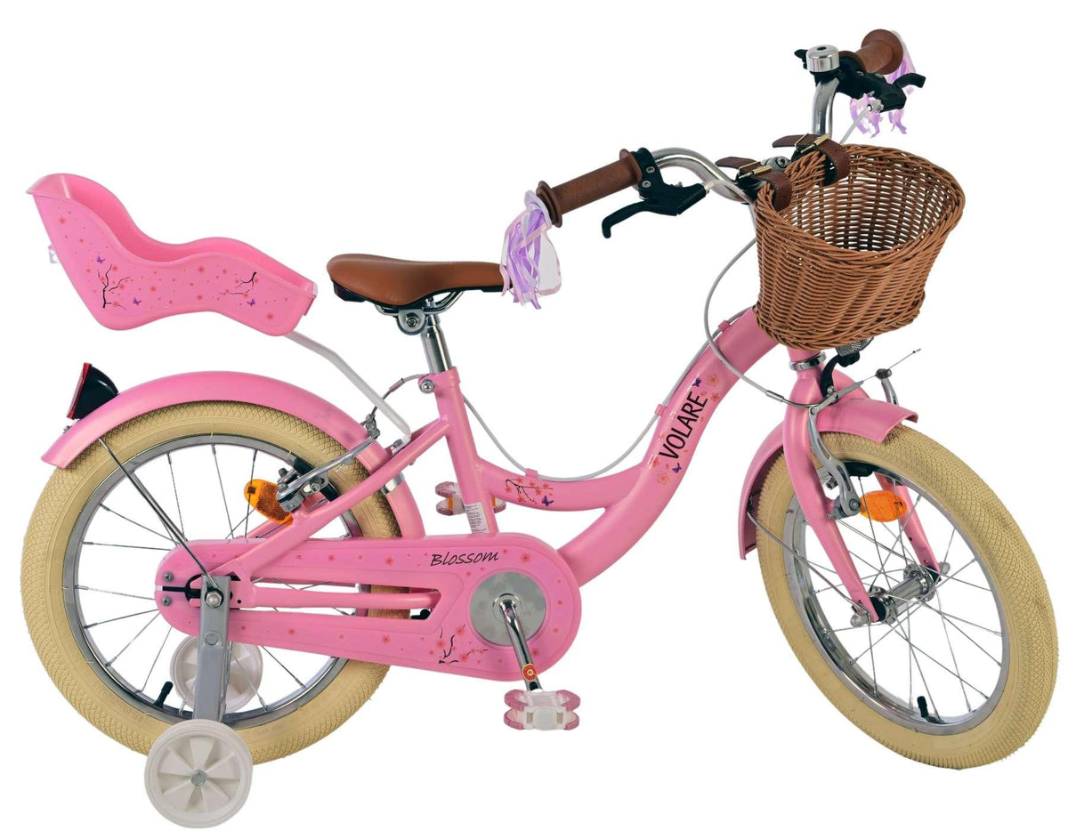 Rosa Kinderfahrrad mit Korb und Sitz für ein Kind hinten