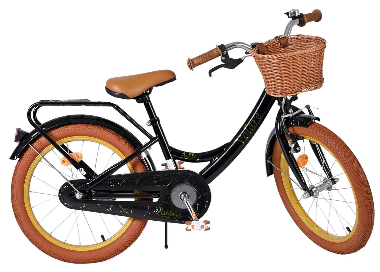 Schwarzes Kinderfahrrad mit Korb, braunen Reifen und beigem Sitz