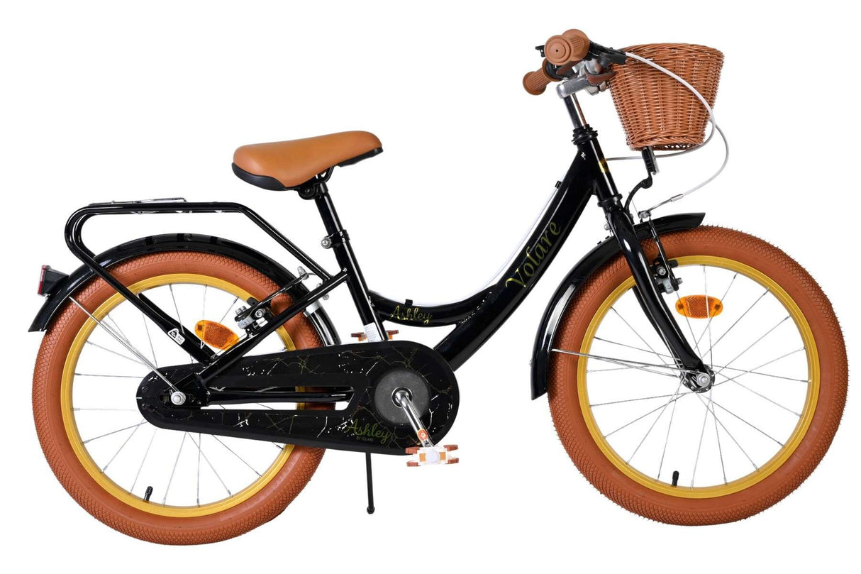 Schwarzes Kinderfahrrad mit braunem Korb und dicken Reifen