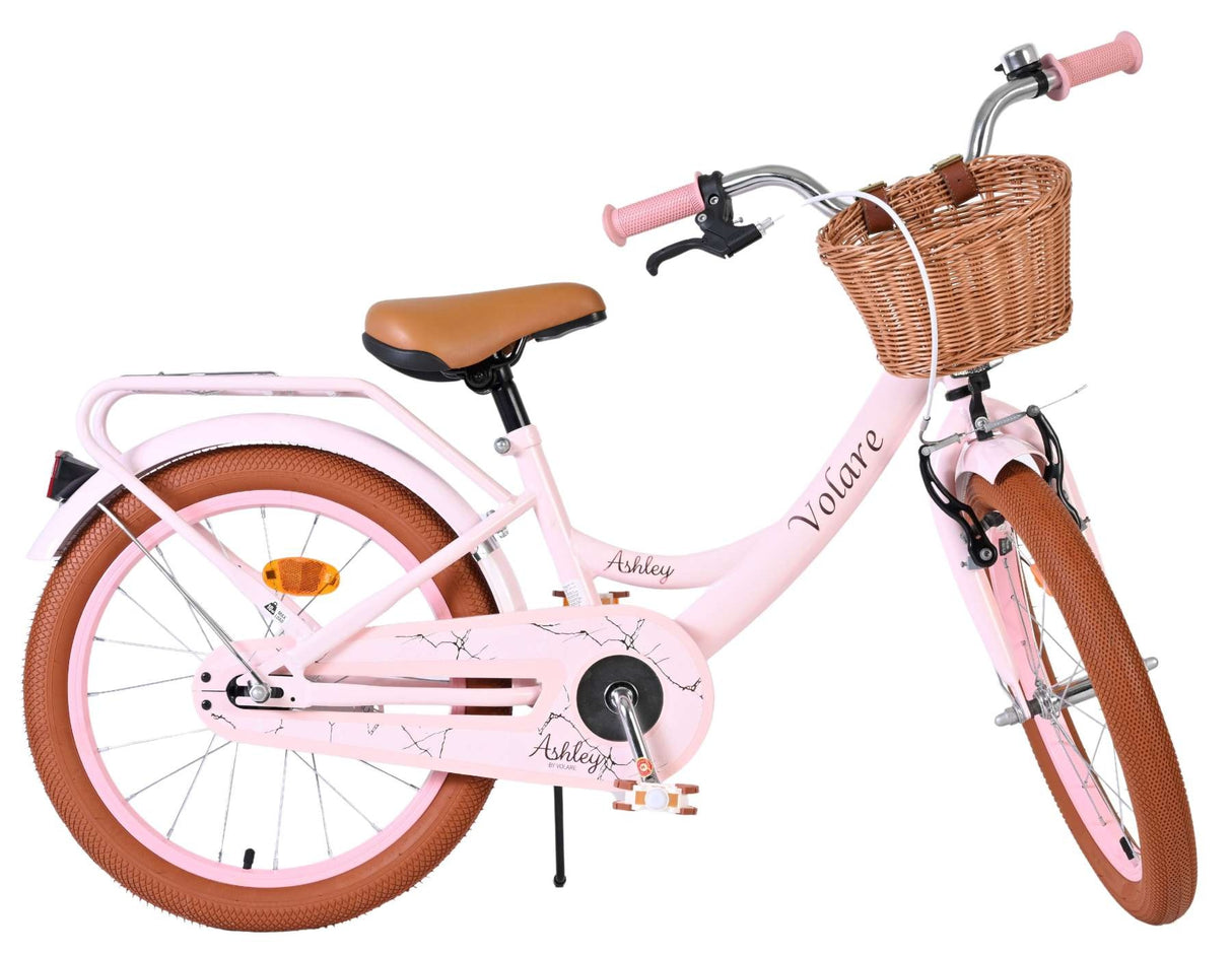 Rosa Damenfahrrad mit Korb und braunen Reifen