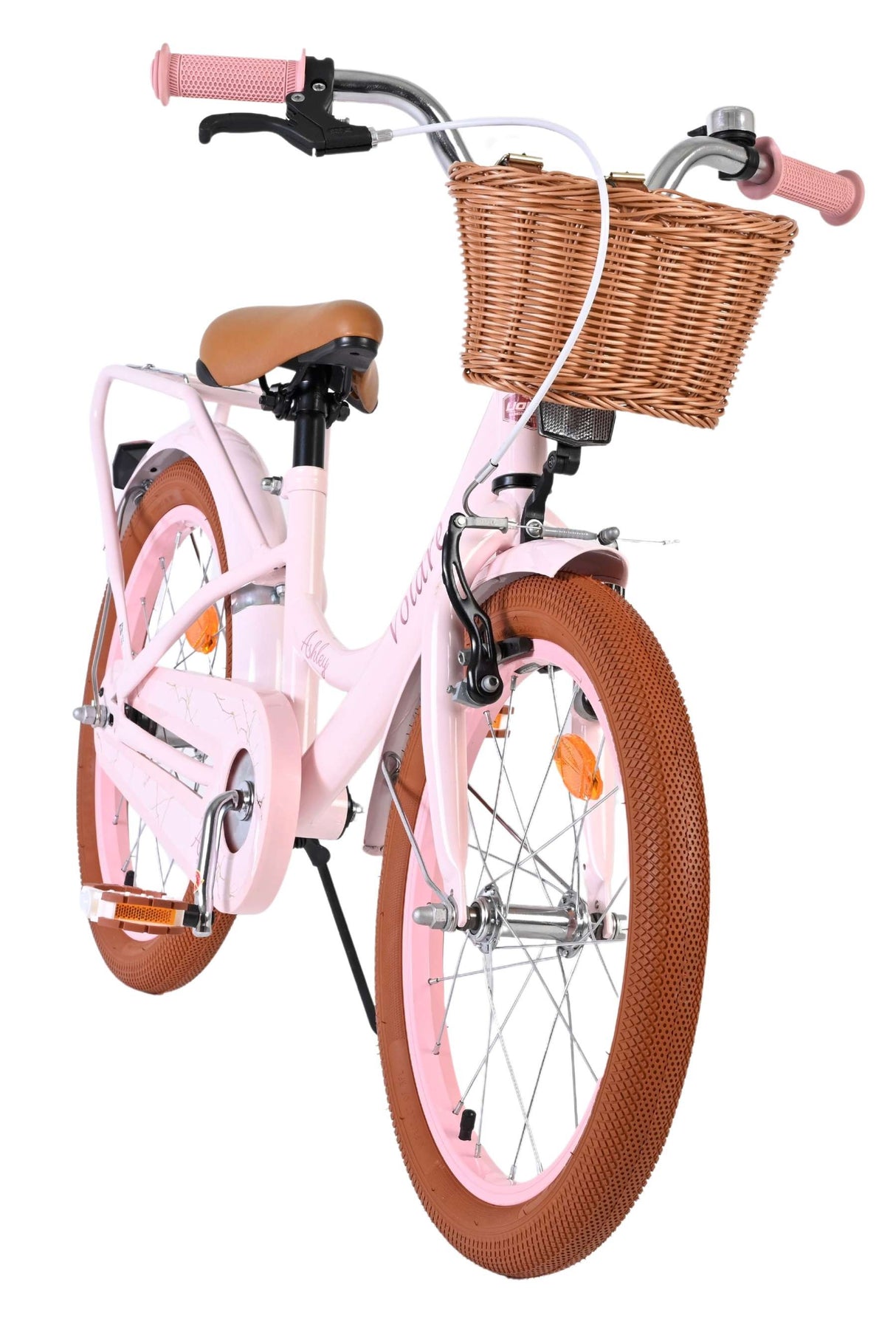 Rosa Kinderfahrrad mit Korb und braunen Reifen