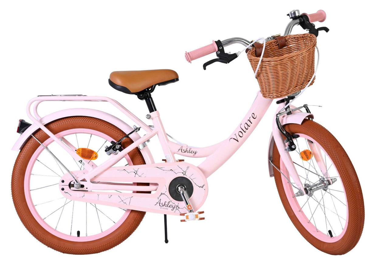 Rosa Damenfahrrad mit Korb und braunen Reifen
