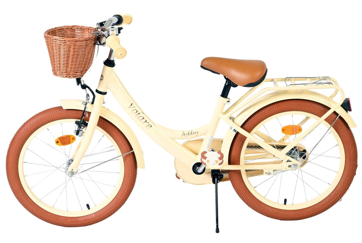 Kinderfahrrad mit Korb, braunen Reifen und beigem Rahmen