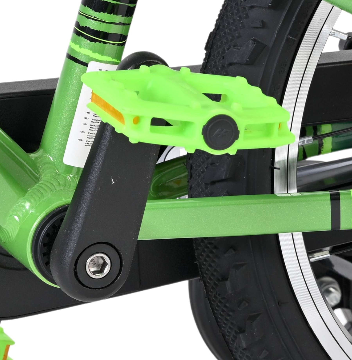 Grünes Fahrradpedal an einem grünen Fahrradrahmen mit schwarzem Antrieb