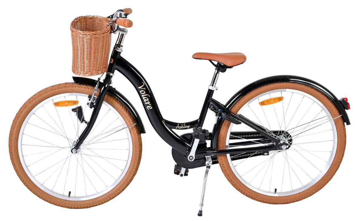 Schwarzes Damenfahrrad mit Korb und braunen Reifen und Sattel