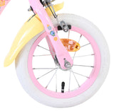 Vorderreifen eines Kinderfahrrads mit bunten Blumenmotiven und weißen Reifen