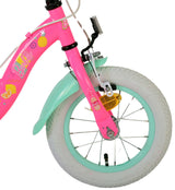 Pinkes Kinderfahrrad mit weißen Reifen und bunten Motiven
