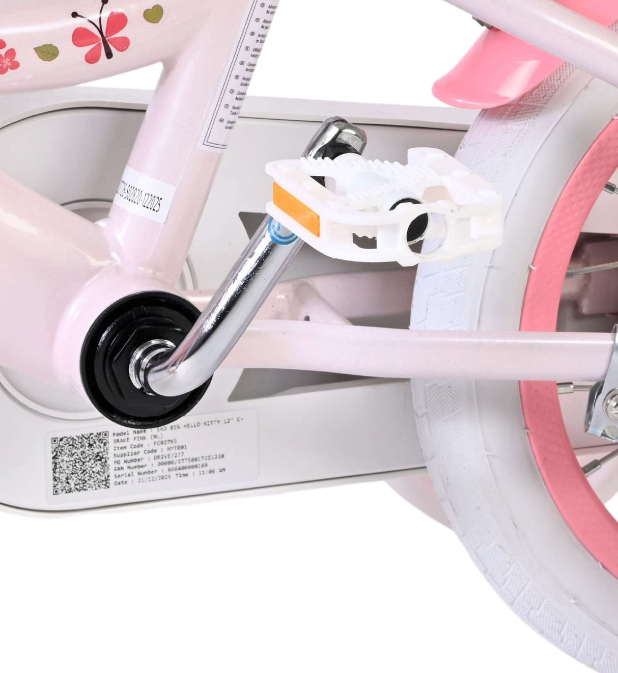Rosa Kinderfahrrad mit weißen Pedalen und bunten Verzierungen