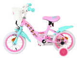 Rosa Kinderfahrrad mit Korb, weißen Reifen und bunten Griffen