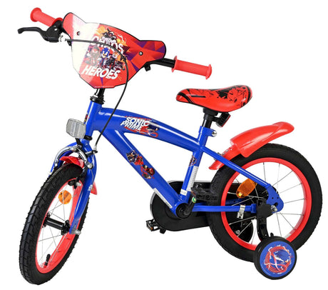 Blaues Kinderfahrrad mit roten Akzenten und Comic-Motiv am Lenker