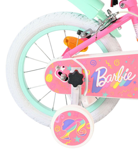 Rosa Kinderfahrrad mit weißen Reifen und bunten Barbie-Motiven