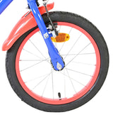Buntes Fahrradrad mit rotem Reifen und reflektierendem Element