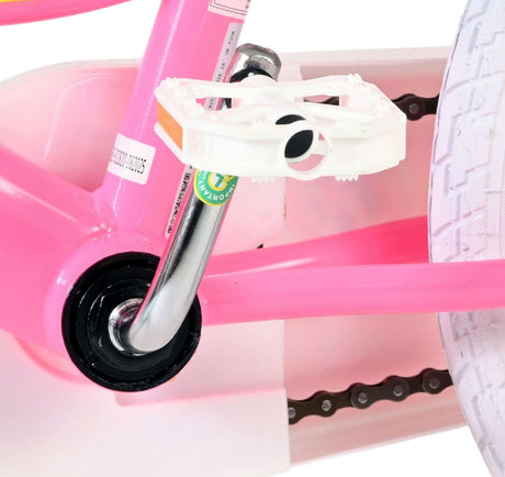 Pinkes Fahrradpedal mit silberner Achse und weißem Pedalaufsatz