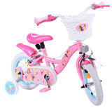 Rosa Kinderfahrrad mit Korb, Stützrädern und bunten Motiven