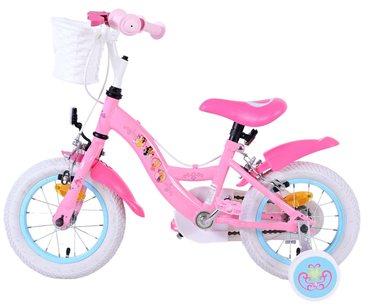 Rosa Kinderfahrrad mit weißen Reifen und Korb vorne