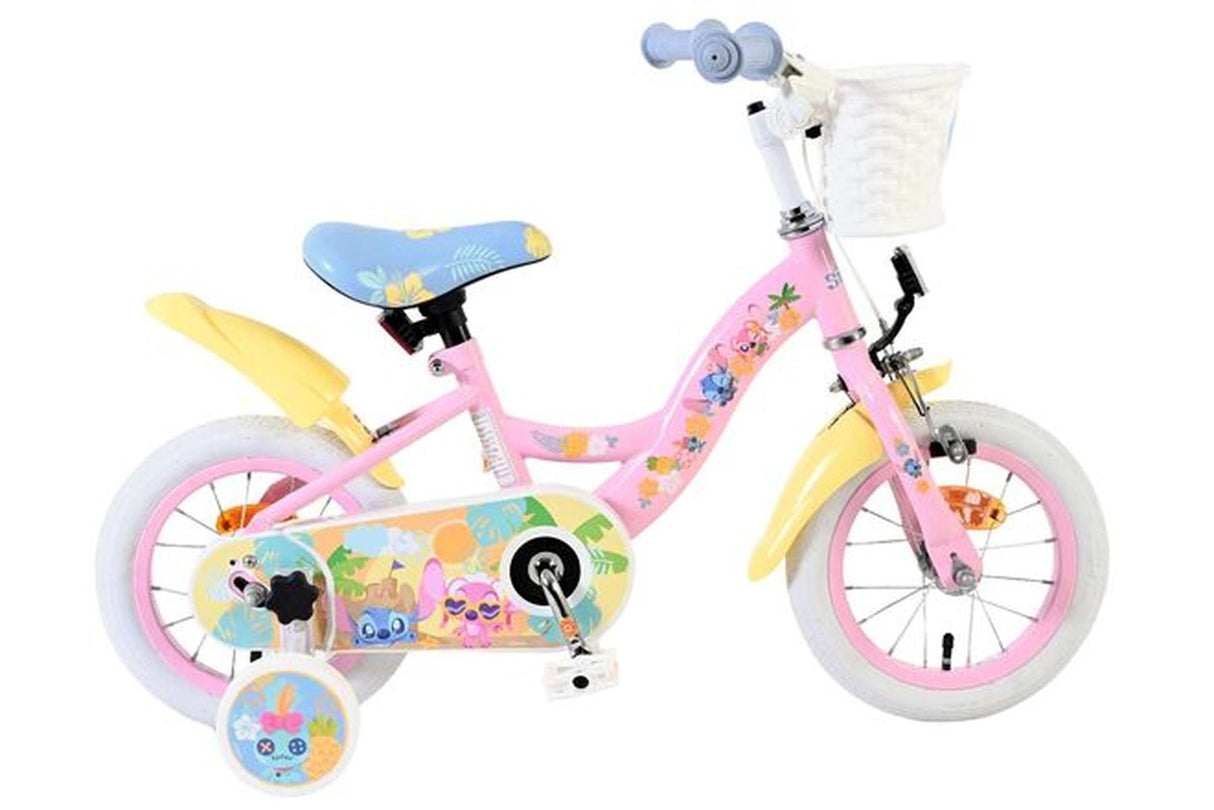 Kinderfahrrad in Pink mit bunten Aufklebern und Korb vorne
