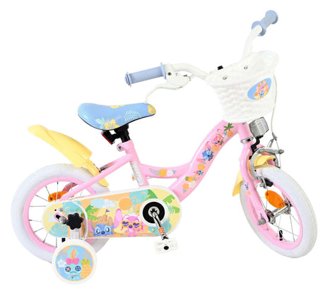 Kinderfahrrad in Pink mit bunten Blumenmotiven und Korb vorne