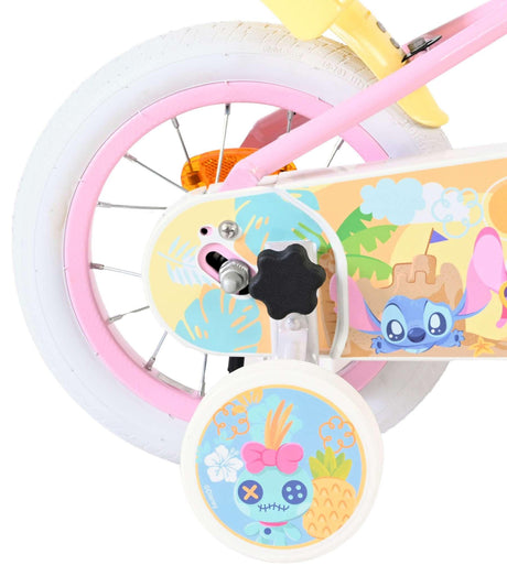 Buntes Kinderfahrrad mit pinken Reifen und Disney-Motiv