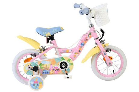 Kinderfahrrad in Pink mit bunten Aufklebern und Korb vorne