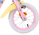 Vorderreifen eines Kinderfahrrads mit buntem Design und weißen Reifen