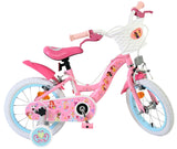 Rosa Kinderfahrrad mit Korb, weißen Reifen und bunten Aufklebern