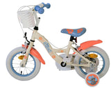 Kinderfahrrad in Creme mit orangefarbenen Akzenten und Korb vorne