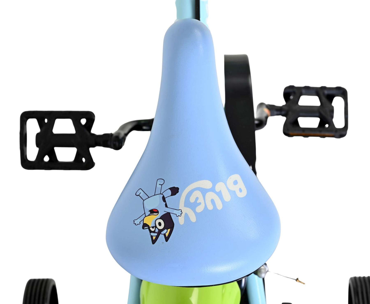 Buntes Kinderfahrrad mit blauem Sattel und Tiermotiv