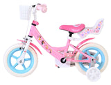 Rosa Kinderfahrrad mit weißen Reifen und Korb vorne