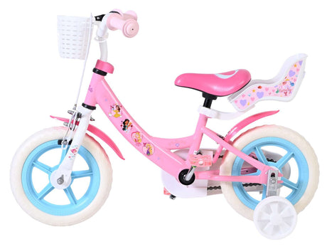 Rosa Kinderfahrrad mit weißen Reifen und Korb vorne
