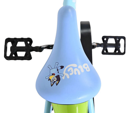 Blaue Fahrradsattel mit Cartoon-Motiv und grüner Unterseite