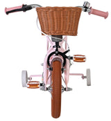 Rosa Kinderfahrrad mit Korb und rutschfesten Pedalen