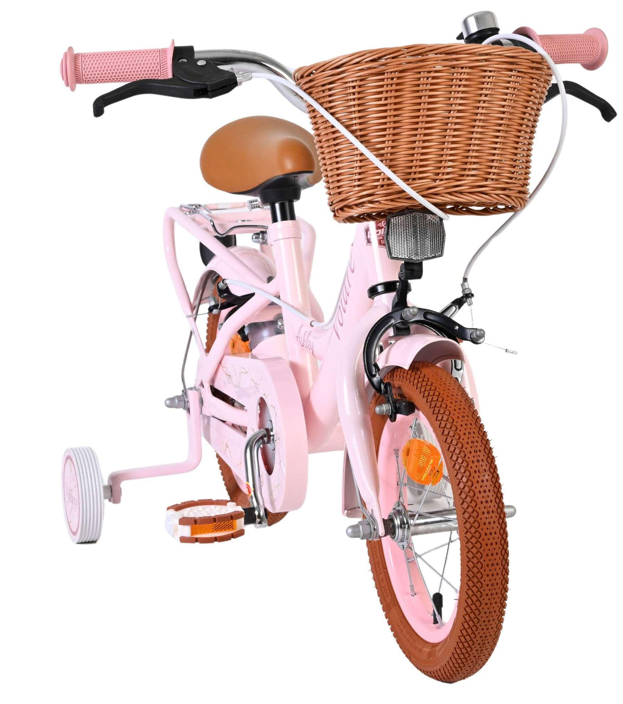 Rosa Kinderfahrrad mit Korb und braunen Reifen