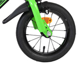 Grünes Fahrrad mit schwarzem Reifen und reflektierendem Element