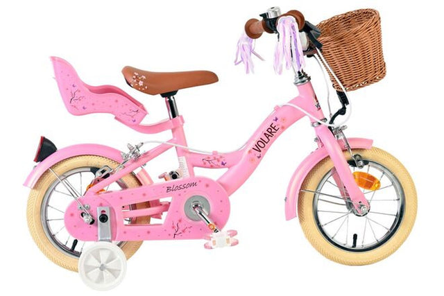 Rosa Kinderfahrrad mit Korb, Sattel und Rücksitz für ein Kind