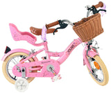 Rosa Kinderfahrrad mit Korb, Blumenmotiv und stabilen Reifen
