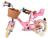 Rosa Kinderfahrrad mit Korb, Sattelstütze und bunten Griffen