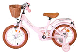 Rosa Kinderfahrrad mit Korb, braunen Reifen und bequemen Sitz