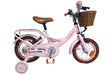 Rosa Kinderfahrrad mit Korb und Stützrädern, brauner Sitz