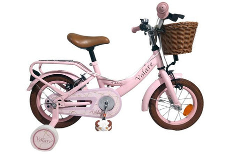 Rosa Kinderfahrrad mit Korb und Stützrädern, brauner Sitz