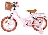 Rosa Kinderfahrrad mit Korb, braunen Reifen und bequemen Sattel