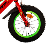 Rotes Fahrrad mit grünem Reifen und dicken, profilierten Gummireifen
