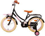 Schwarzes Kinderfahrrad mit pinken Akzenten und stabilen Stützrädern