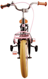 Fahrrad mit pinkem Rahmen, breiten Reifen und braunen Griffen