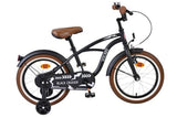 Schwarzes Kinderfahrrad mit braunen Reifen und gepolstertem Sattel