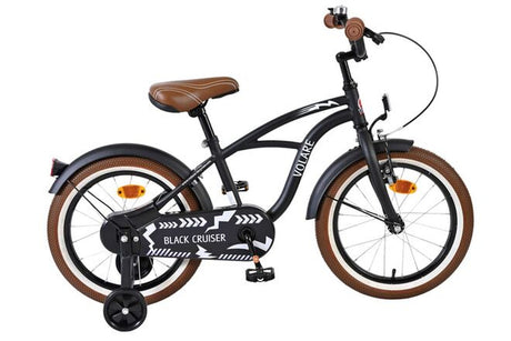 Schwarzes Kinderfahrrad mit braunen Reifen und gepolstertem Sattel