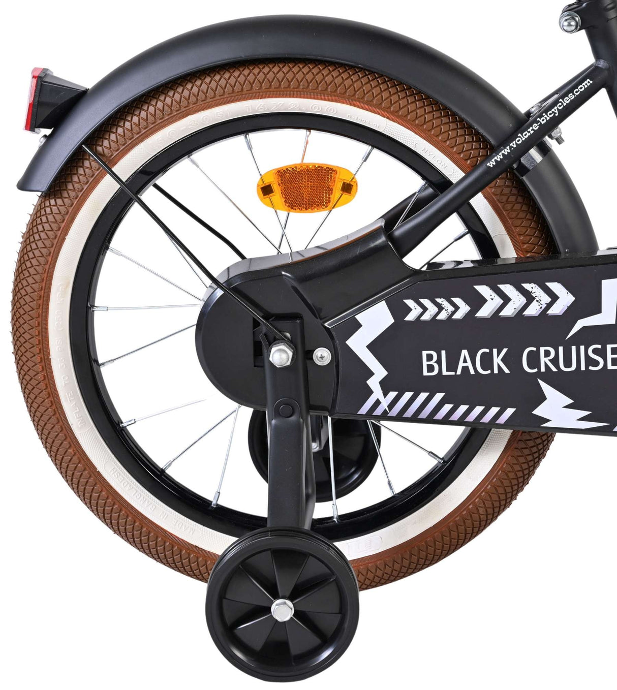 Schwarzes Fahrrad mit braunem Reifen und reflektierendem Rücklicht