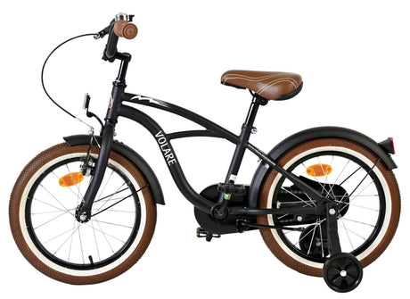Schwarzes Kinderfahrrad mit braunen Reifen und gepolstertem Sattel